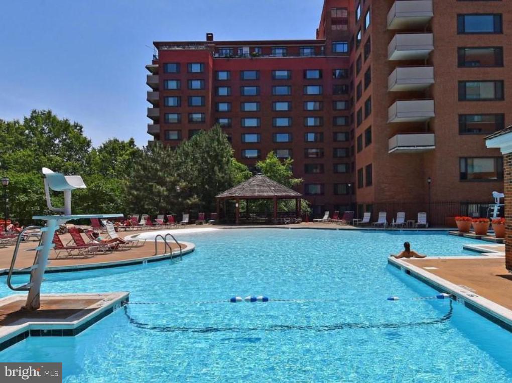 1111 Arlington Boulevard, Unit 615 Arlington, VA 22209 - Photo 13 of 37 a backyard of a house with lots of green space and fountain