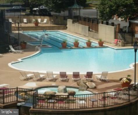 1111 Arlington Boulevard, Unit 615 Arlington, VA 22209 - Photo 14 of 37 a view of a swimming pool with a patio and a yard