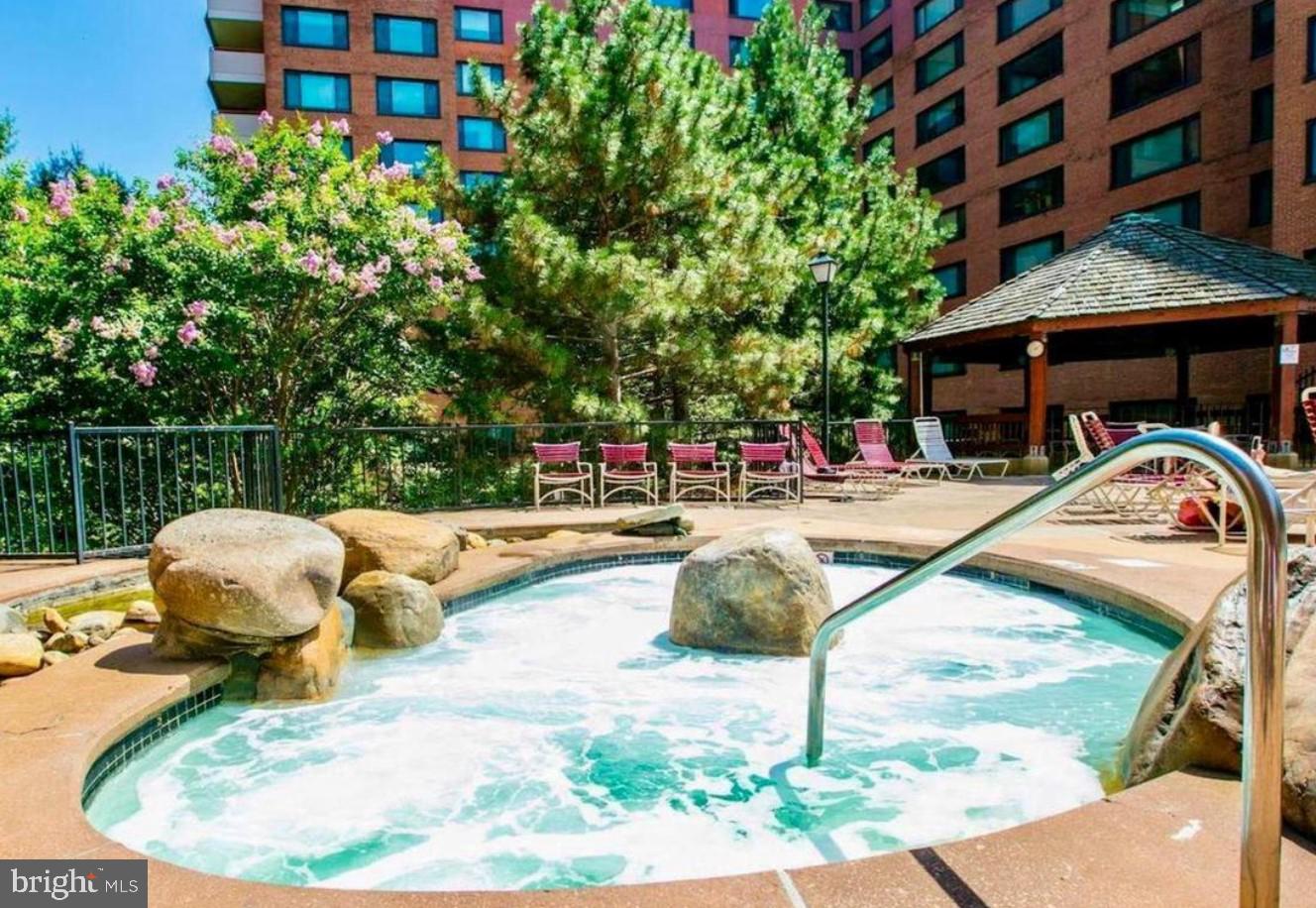 1111 Arlington Boulevard, Unit 615 Arlington, VA 22209 - Photo 15 of 37 a view of swimming pool with a lounge chairs