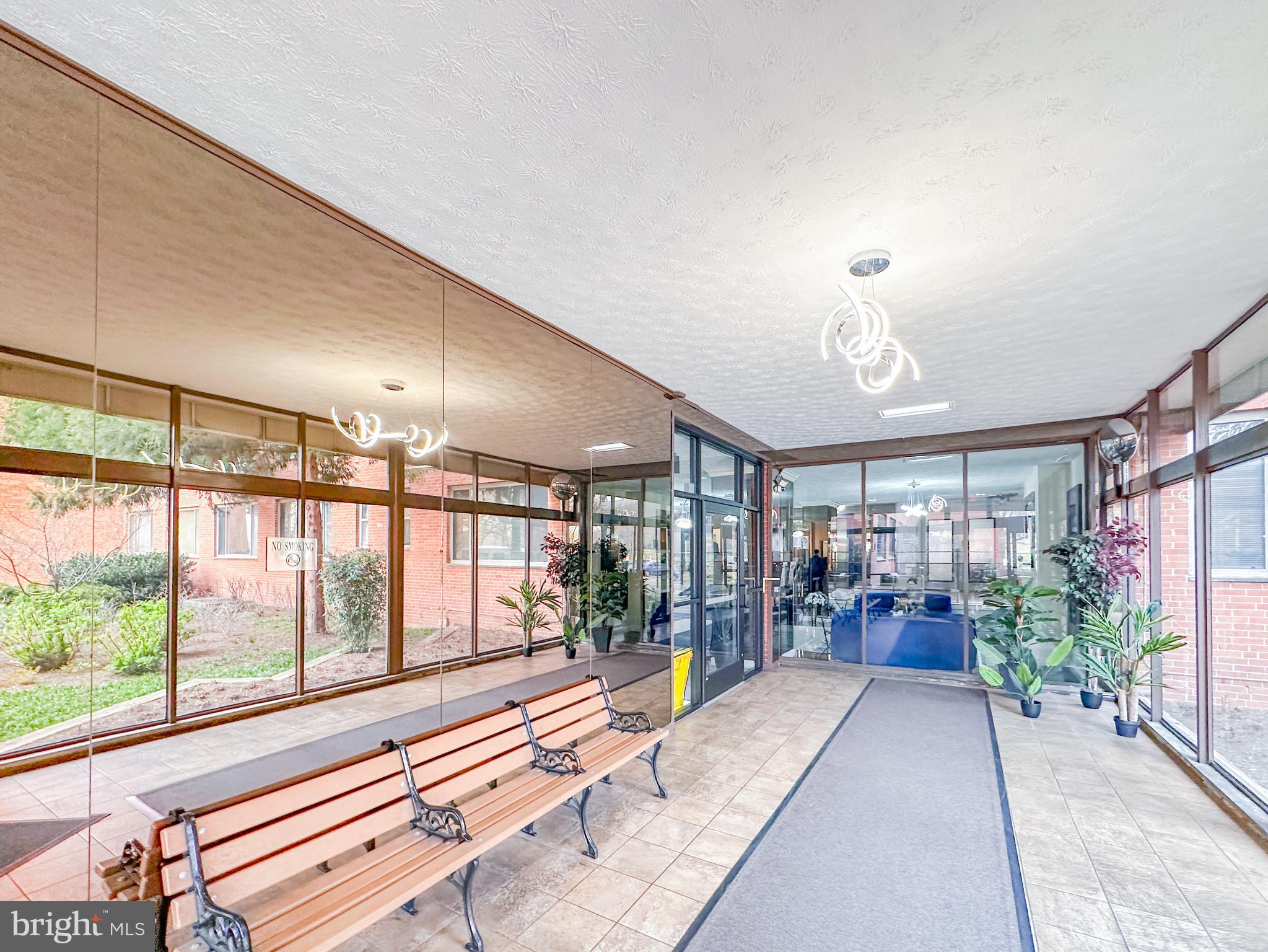 1111 Arlington Boulevard, Unit 615 Arlington, VA 22209 - Photo 3 of 37 a living room with furniture and a large window