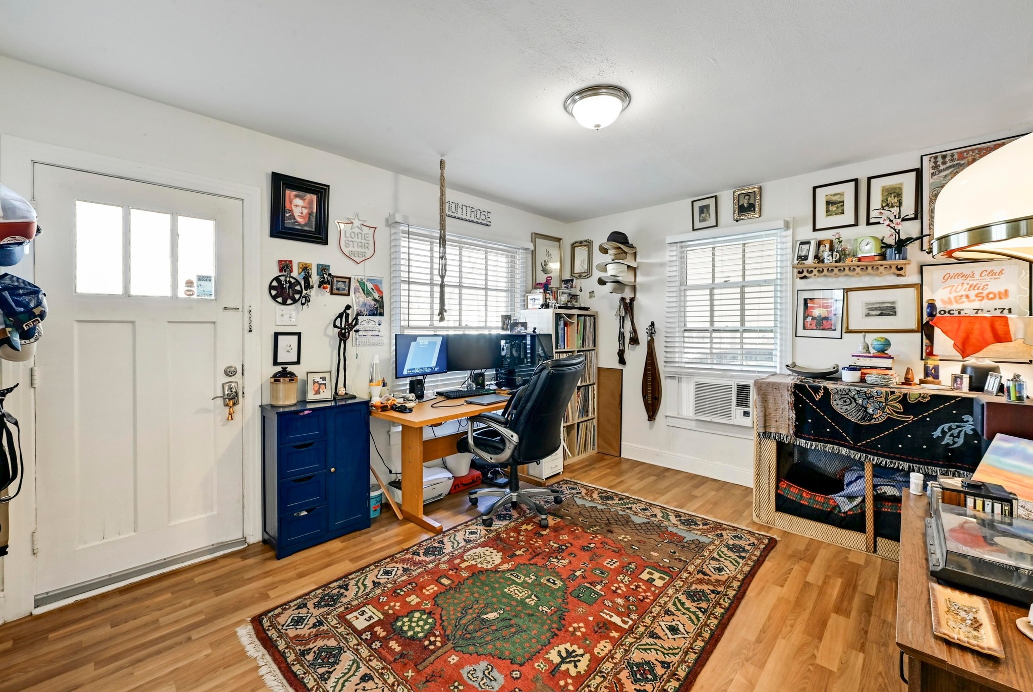 4530 Avenue D, Unit B Austin, TX 78751 - Photo 6 of 29 a view of a workspace with furniture and a window