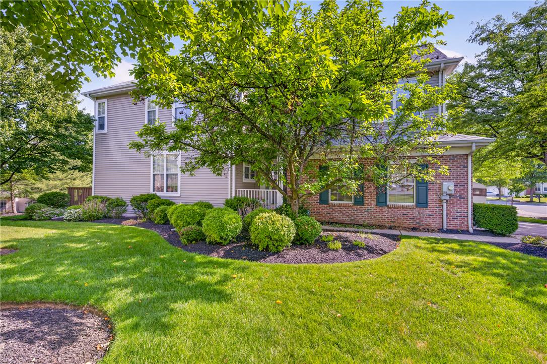 4345 Creek Road Allentown, PA 18104 - Photo 1 of 33 A well-maintained facade features a mix of brick and siding, framed by vibrant green landscaping and mature trees.