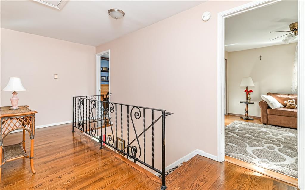 463 Inwood Road Pittsburgh, PA 15237 - Photo 17 of 47 a view of a hallway with wooden floor and furniture