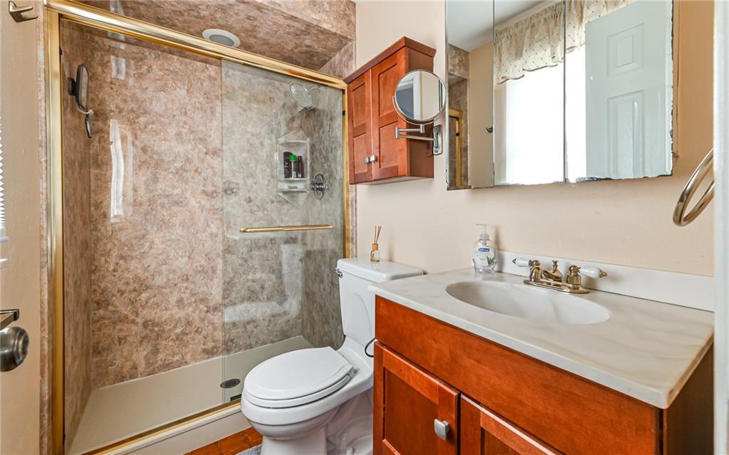 463 Inwood Road Pittsburgh, PA 15237 - Photo 21 of 47 a bathroom with a sink toilet a mirror and shower
