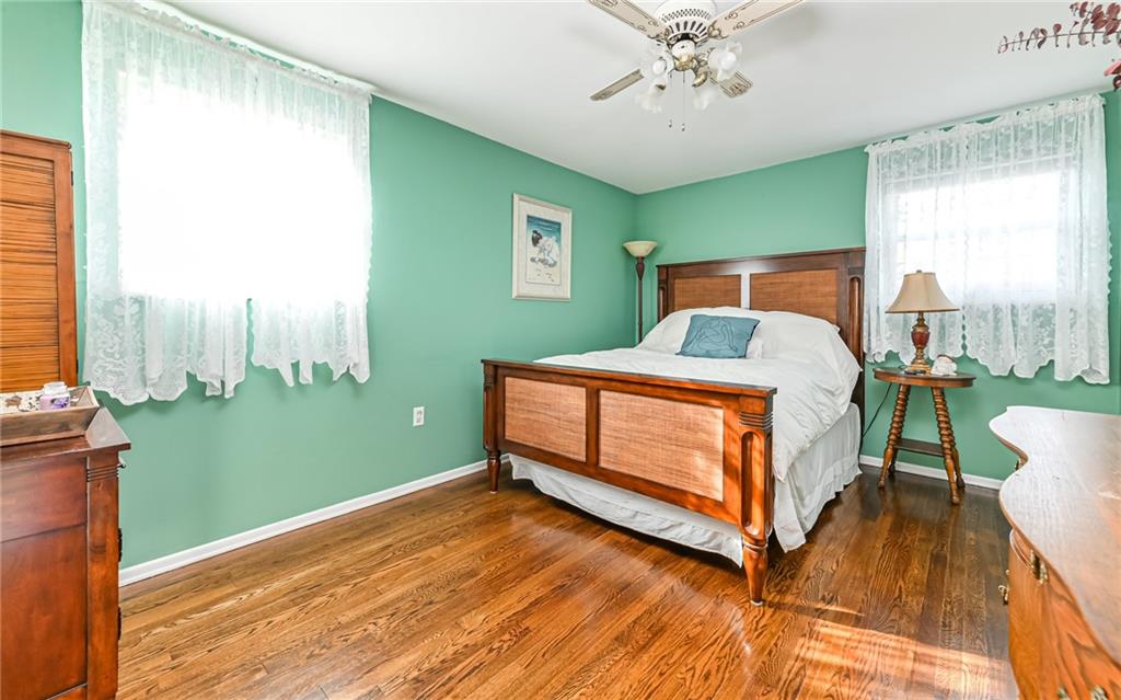 463 Inwood Road Pittsburgh, PA 15237 - Photo 22 of 47 a bedroom with a bed windows and a chandelier