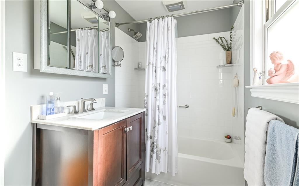 463 Inwood Road Pittsburgh, PA 15237 - Photo 23 of 47 a bathroom with a sink a mirror and a shower