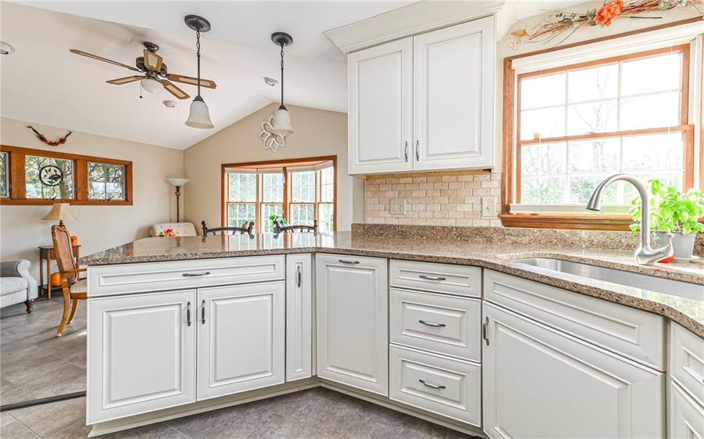 463 Inwood Road Pittsburgh, PA 15237 - Photo 8 of 47 a kitchen with white cabinets and window