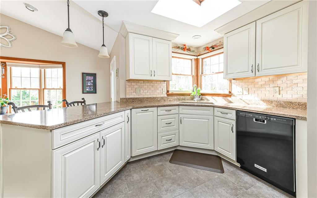463 Inwood Road Pittsburgh, PA 15237 - Photo 9 of 47 a kitchen with a sink window and cabinets