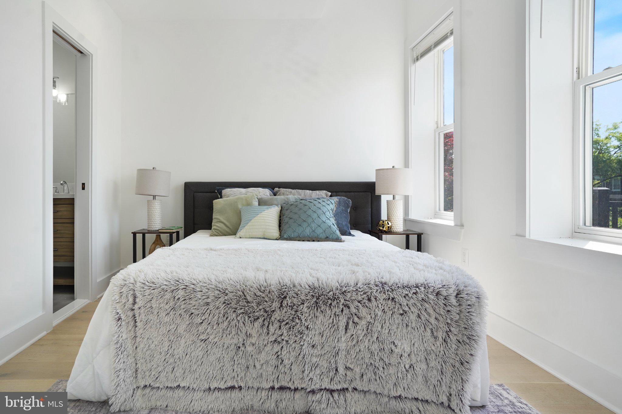 112 V Street Northeast Washington, DC 20002 - Photo 20 of 25 a bedroom with a bed and window