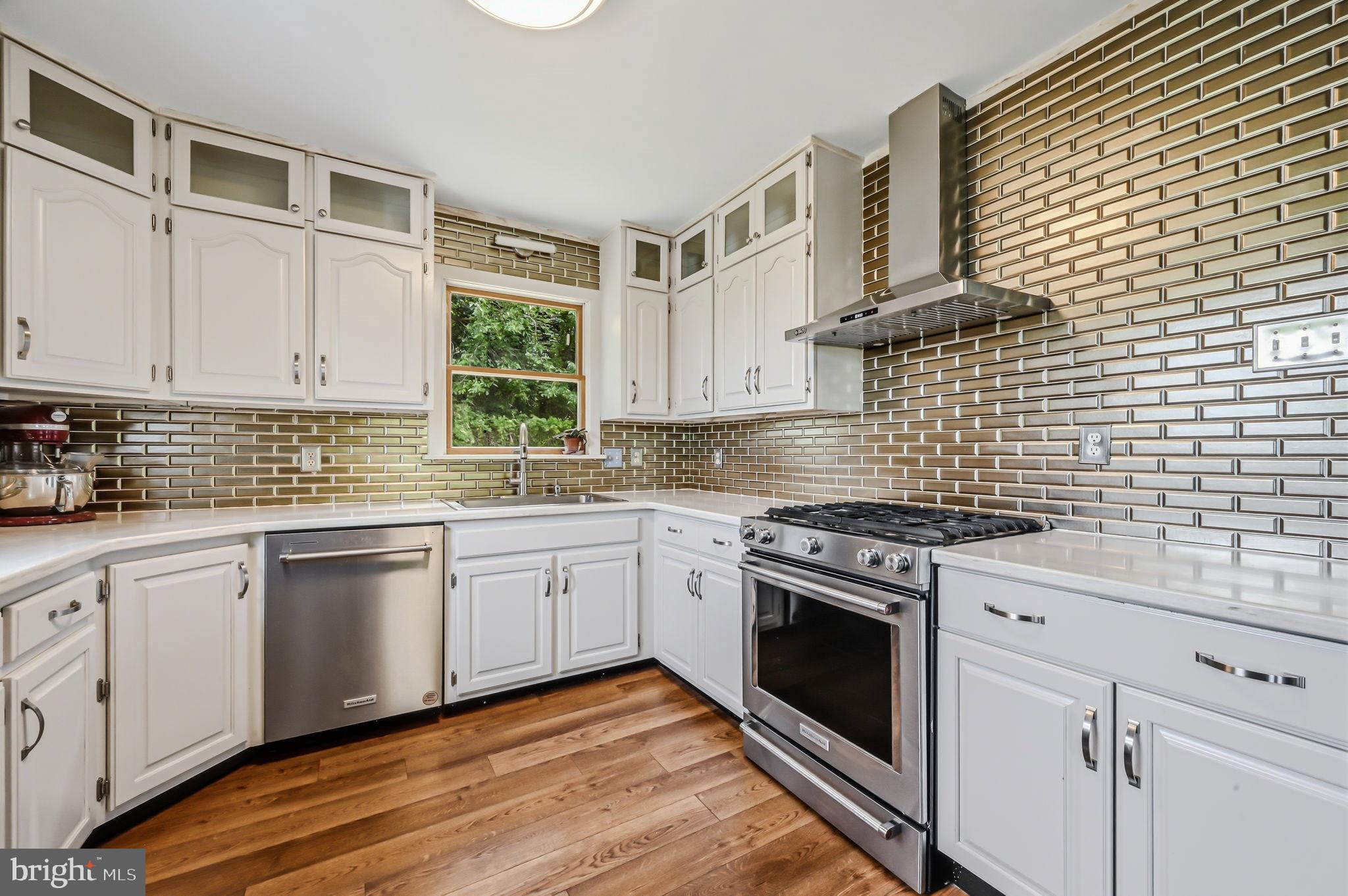 210 Elk View Road North East, MD 21901 - Photo 15 of 64 a kitchen with cabinets appliances and a window