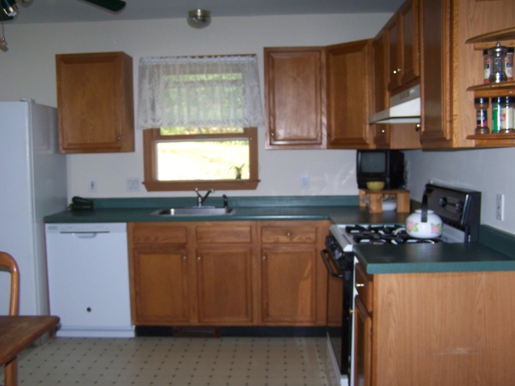 1388 Brimfield Road Warren, MA 01010 - Photo 8 of 21 a kitchen with stainless steel appliances granite countertop a sink stove and cabinets