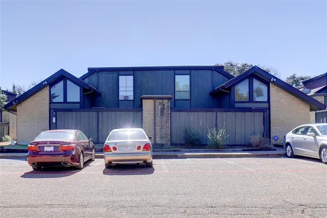 a car parked in front of a house