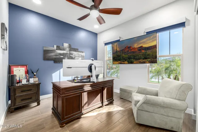 a dining room with furniture and a flat screen tv