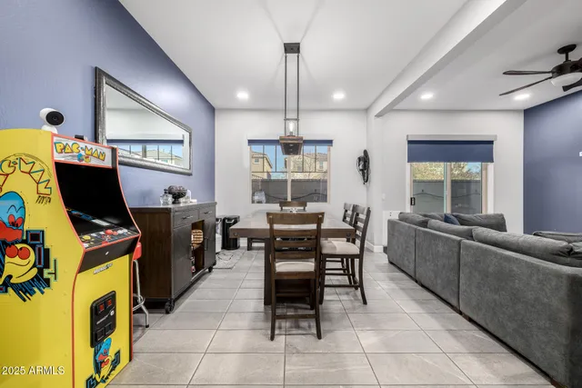 a kitchen with kitchen island granite countertop a sink a counter top space stainless steel appliances and cabinets
