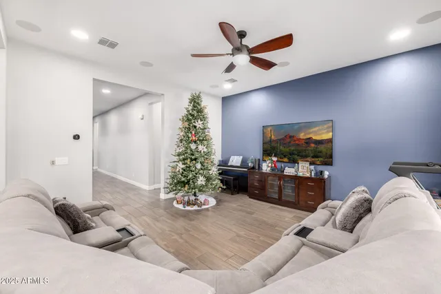 a kitchen with stainless steel appliances granite countertop a sink and white cabinets