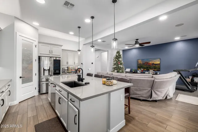 a bathroom with a granite countertop toilet sink and mirror