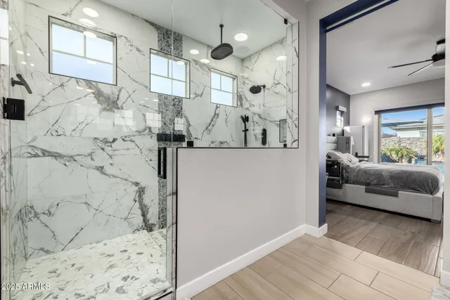 a living room with furniture pool table flat screen tv and outdoor view