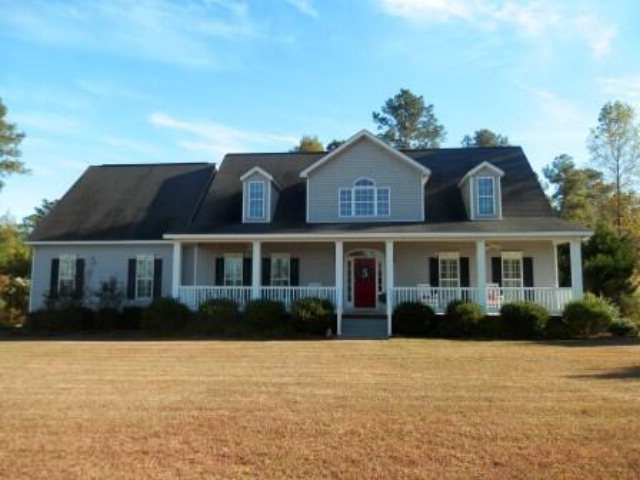 700 Jenkins Road Forsyth, GA 31029 - Photo 1 of 11 a front view of house with yard and green space