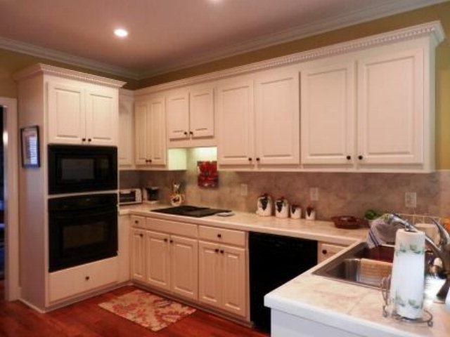 700 Jenkins Road Forsyth, GA 31029 - Photo 5 of 11 a kitchen with a sink and cabinets