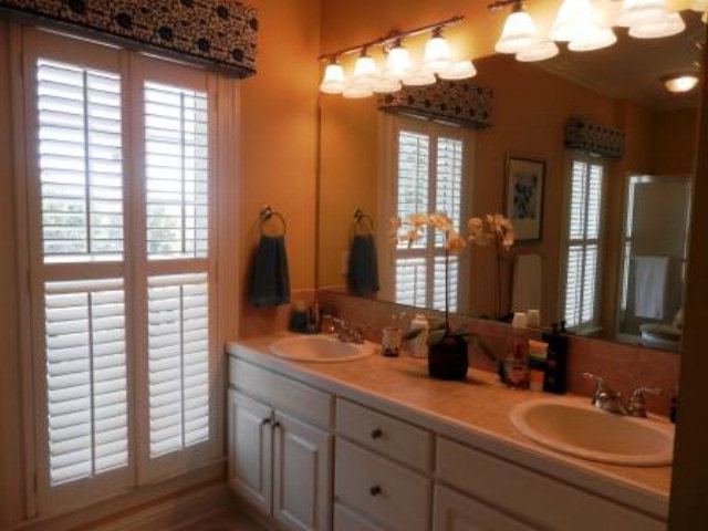 700 Jenkins Road Forsyth, GA 31029 - Photo 8 of 11 a bathroom with a double vanity sink and a mirror