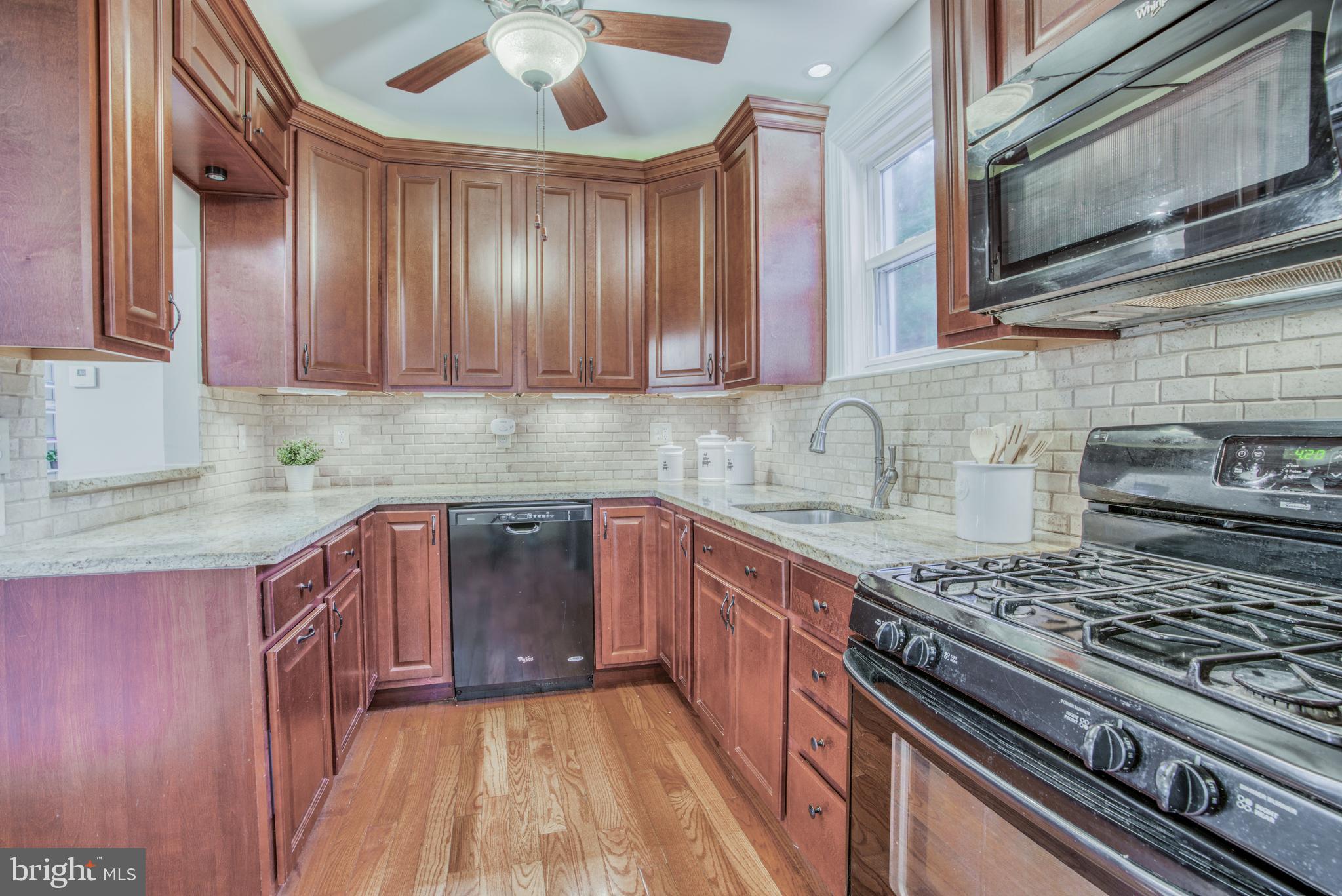 7301 Old Harford Road Baltimore, MD 21234 - Photo 14 of 24 UNDER CABINET COUNTER LIGHTING + CEILING LIGHTING