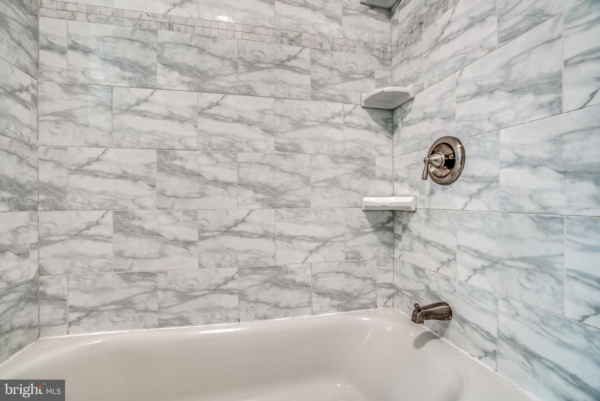 7301 Old Harford Road Baltimore, MD 21234 - Photo 17 of 24 PORCELAIN TILE STUB SURROUND