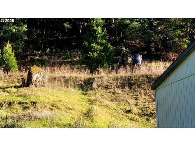 a view of walk in closet with clothes