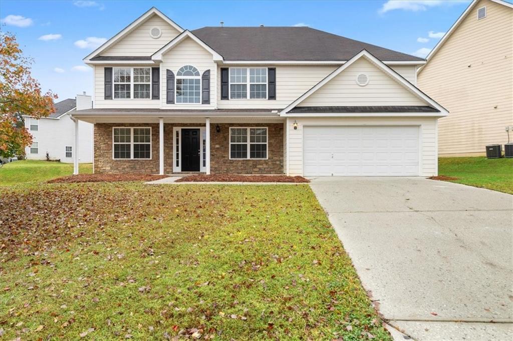 front view of a house with a yard