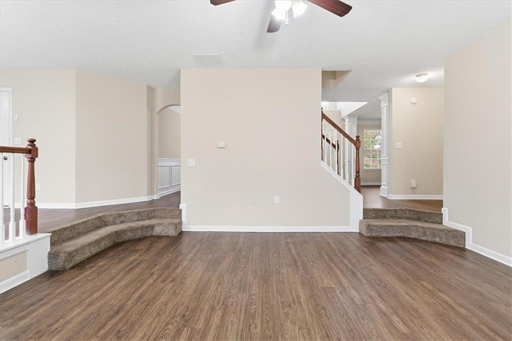 2827 Riders Court Northeast Dacula, GA 30019 - Photo 11 of 41 wooden floor in an empty room with a window