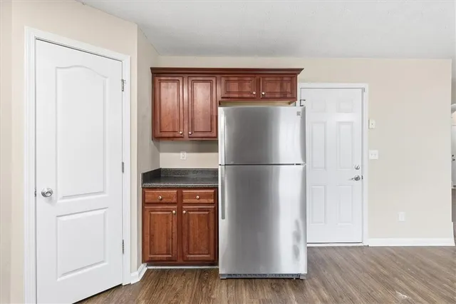 a utility room with wooden floor