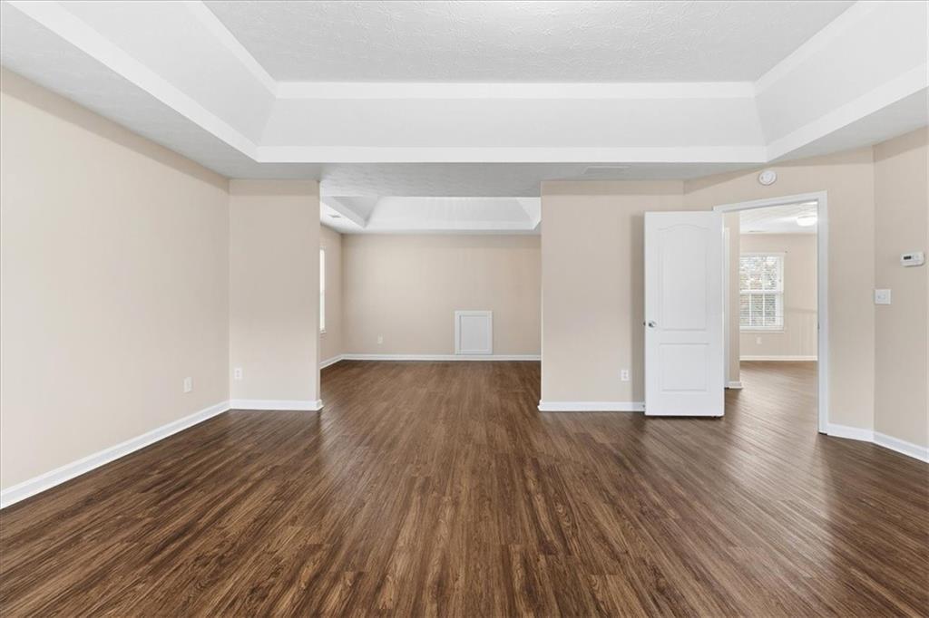 2827 Riders Court Northeast Dacula, GA 30019 - Photo 20 of 41 a view of an empty room and wooden floor