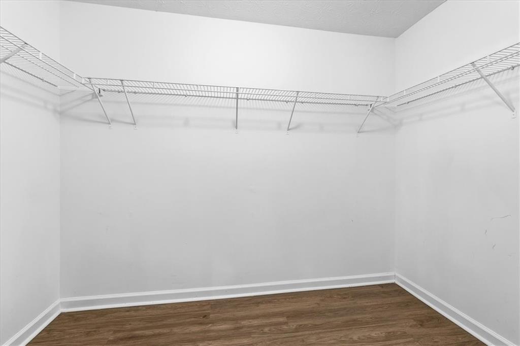 2827 Riders Court Northeast Dacula, GA 30019 - Photo 27 of 41 a view of a room with racks on the wall