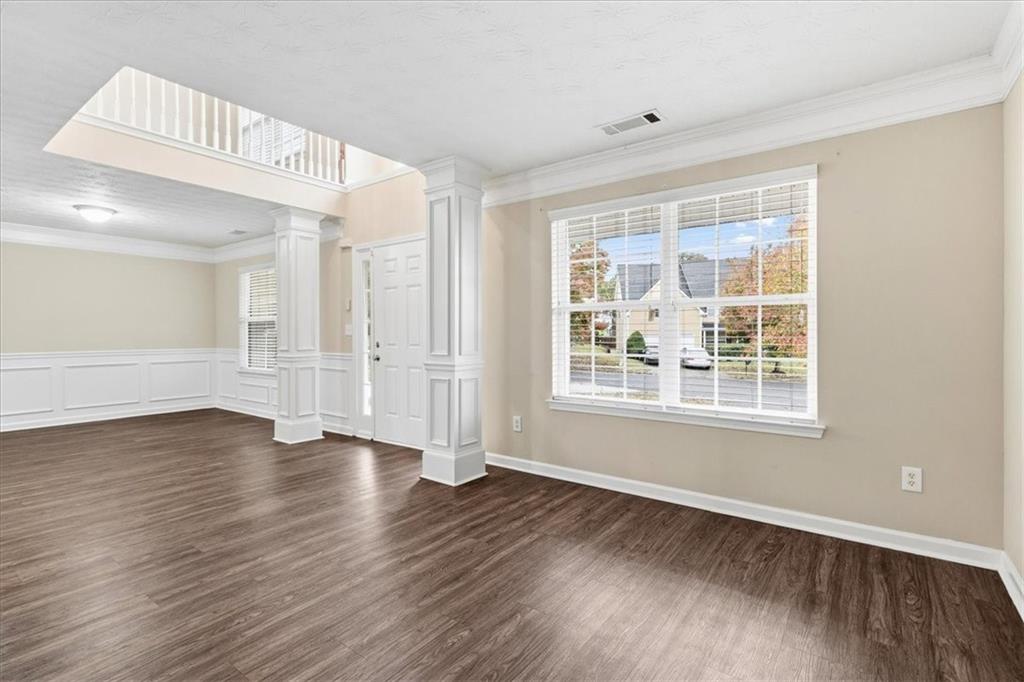 2827 Riders Court Northeast Dacula, GA 30019 - Photo 32 of 41 a view of an empty room with wooden floor and a window