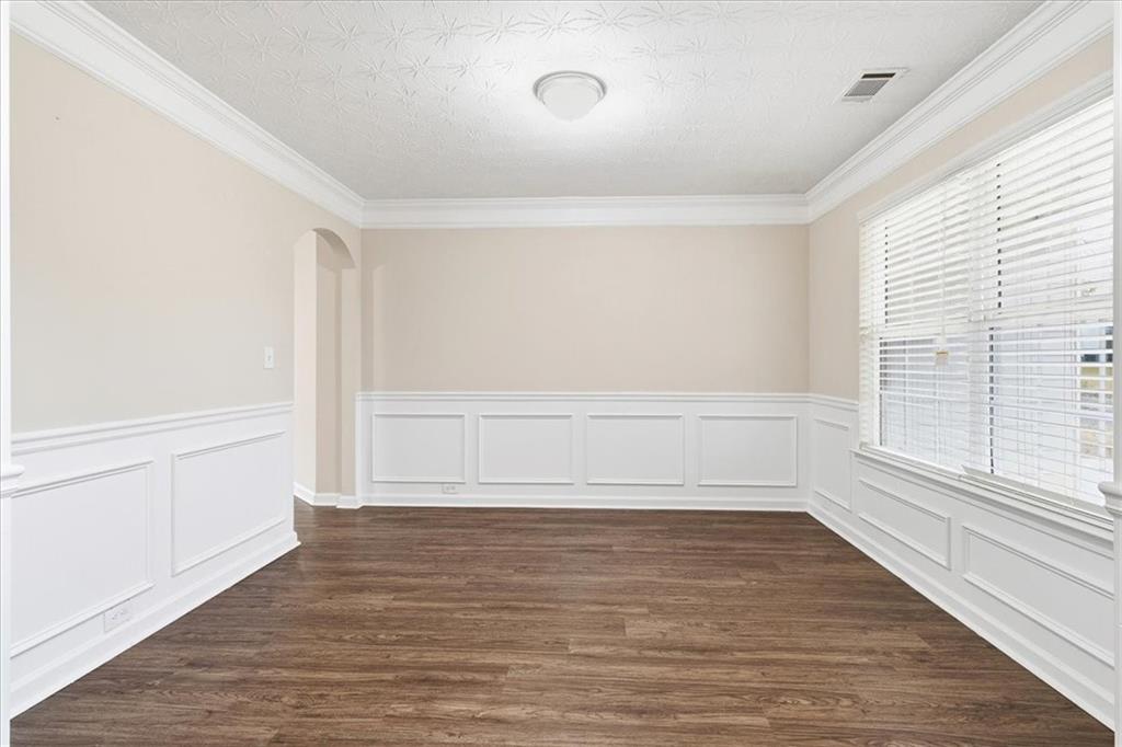 2827 Riders Court Northeast Dacula, GA 30019 - Photo 34 of 41 wooden floor in an empty room with a window