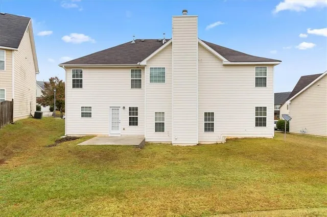 a view of a swimming pool with an outdoor space and seating area