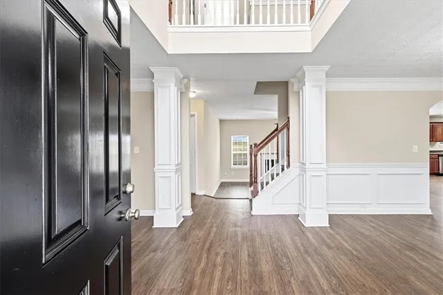 a view of entryway with wooden floor