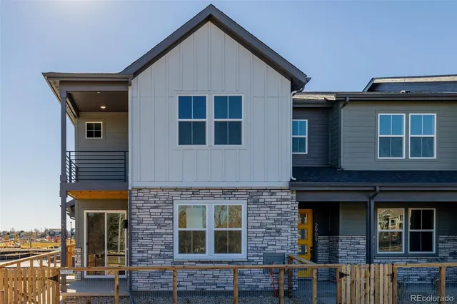 a front view of a house with glass windows