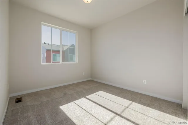 a view of a room with white doors