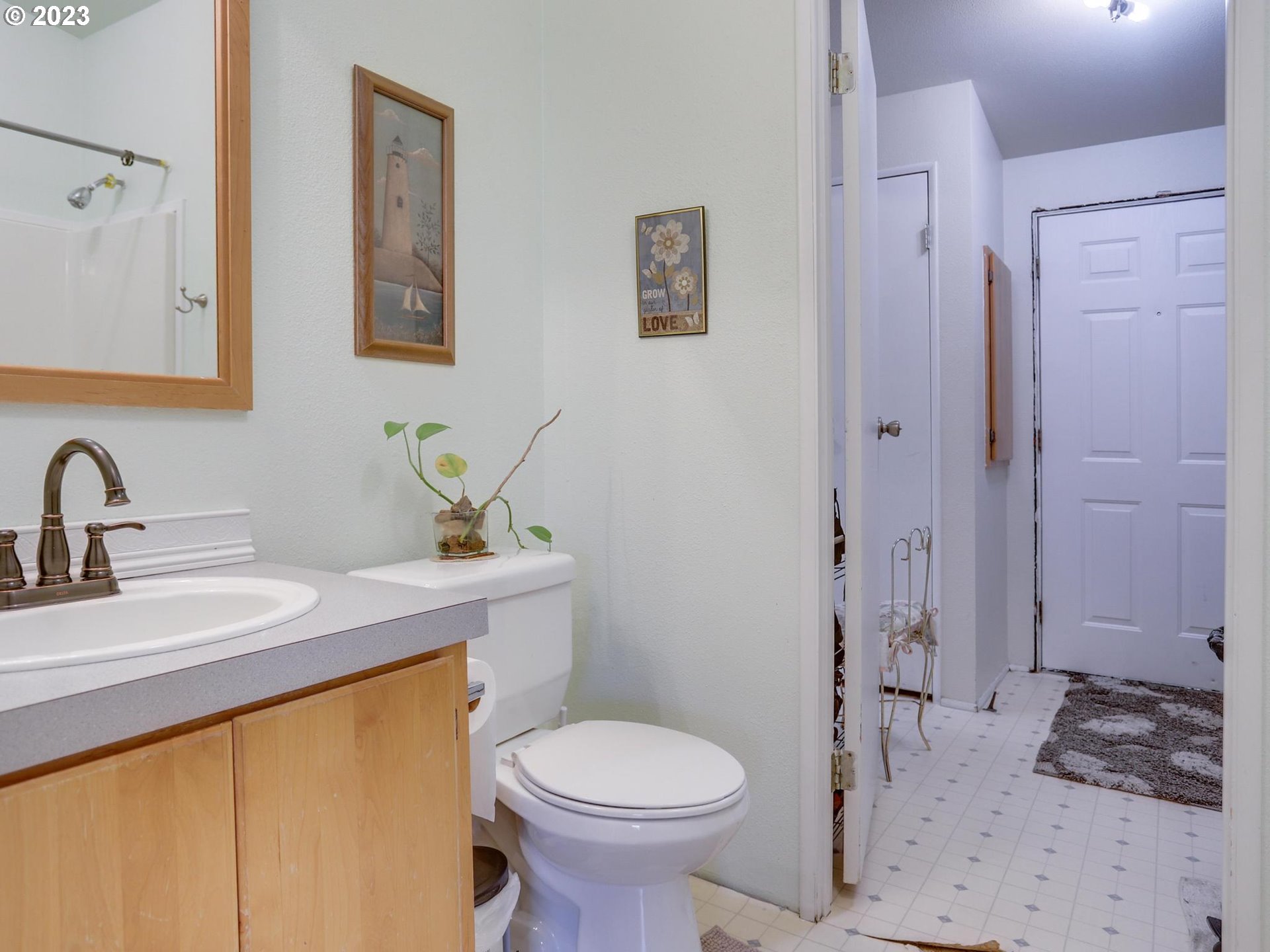1819 Southeast Orient Drive, Unit 1 Gresham, OR 97080 - Photo 18 of 30 a bathroom with a sink toilet and shower