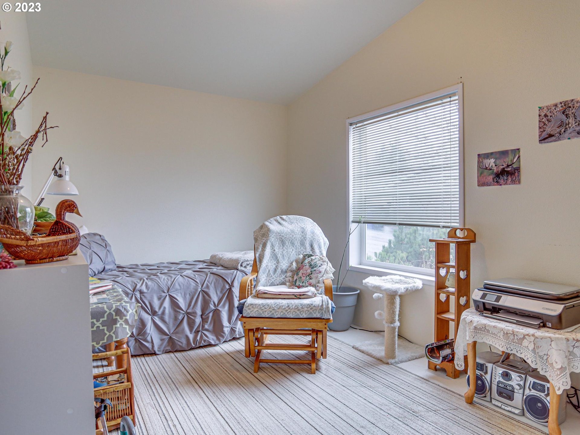 1819 Southeast Orient Drive, Unit 1 Gresham, OR 97080 - Photo 19 of 30 a bedroom with furniture and a wooden floor