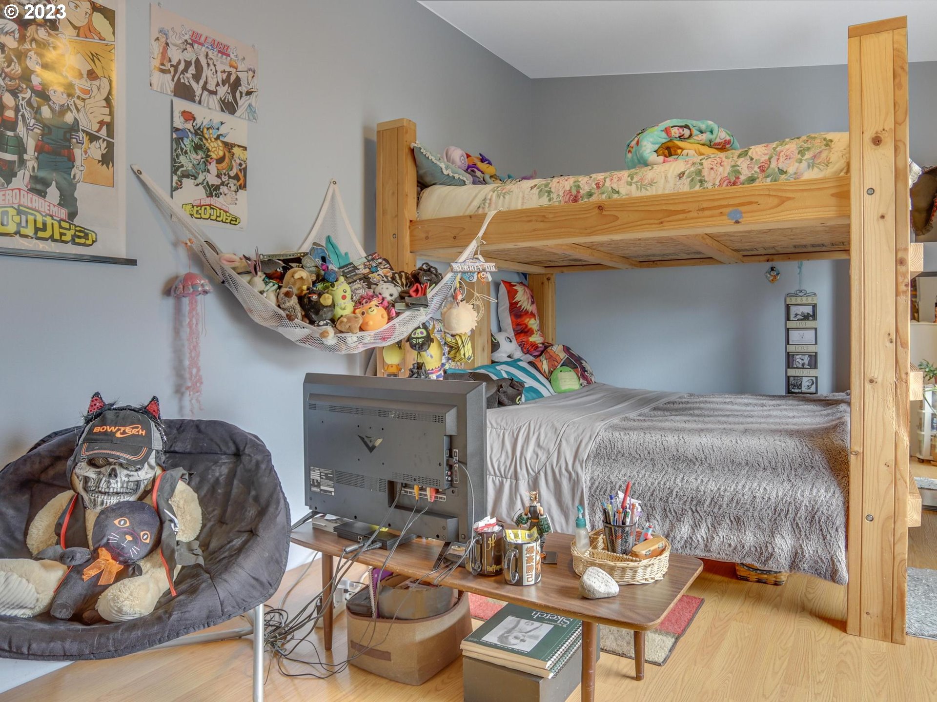 1819 Southeast Orient Drive, Unit 1 Gresham, OR 97080 - Photo 22 of 30 a bedroom with furniture and a chandelier