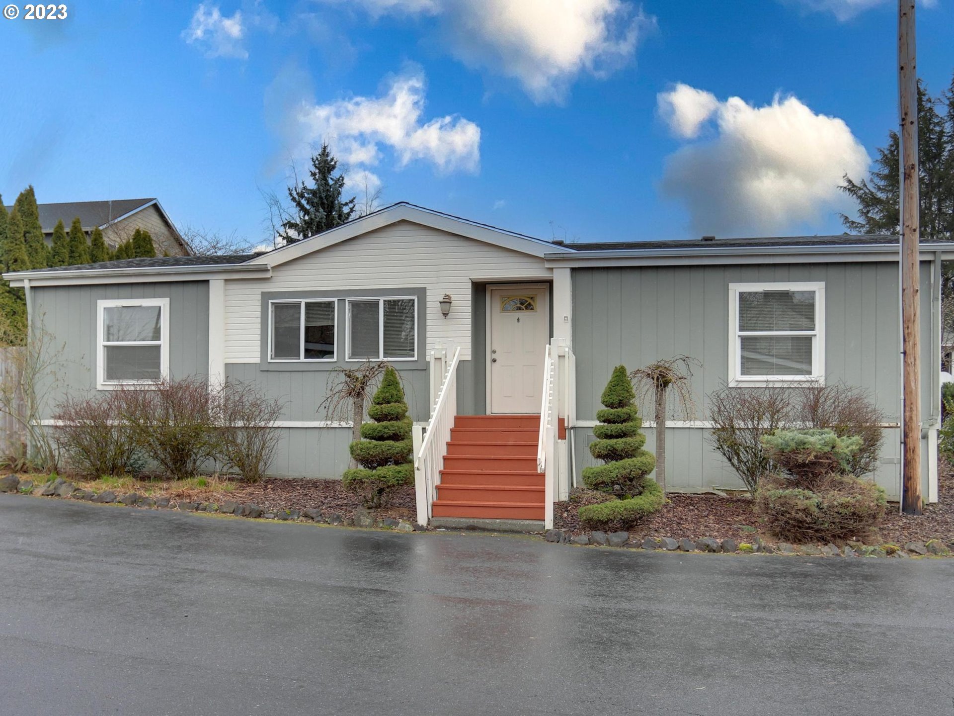 1819 Southeast Orient Drive, Unit 1 Gresham, OR 97080 - Photo 24 of 30 a front view of a house with a yard