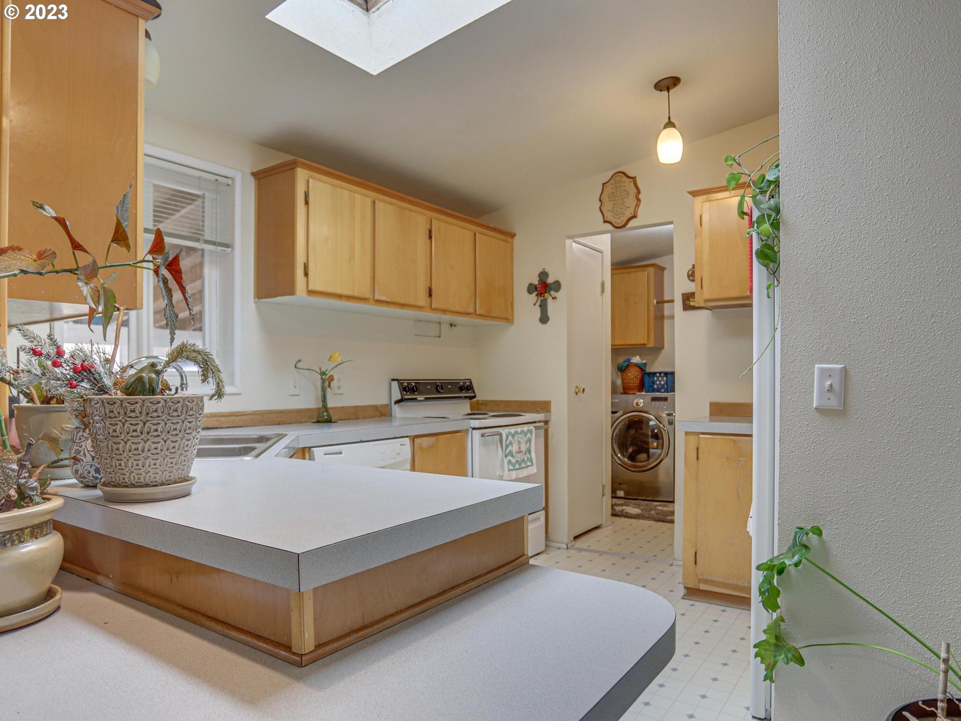 1819 Southeast Orient Drive, Unit 1 Gresham, OR 97080 - Photo 9 of 30 a kitchen with a refrigerator and a sink