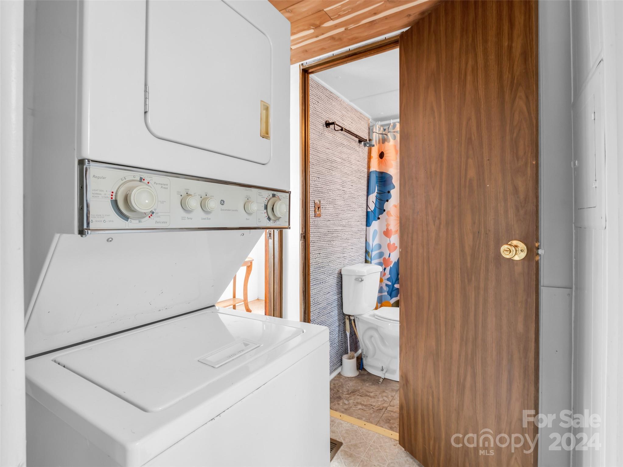 1730 Judes Gap Road Mill Spring, NC 28756 - Photo 15 of 37 a utility room with dryer and washer
