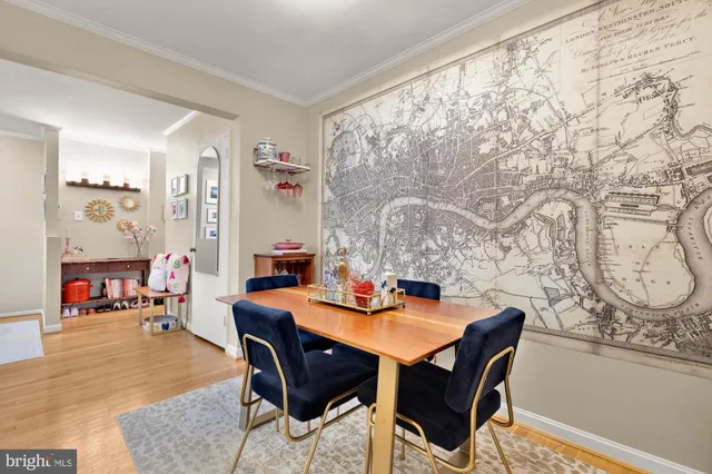a dining room with furniture and wooden floor