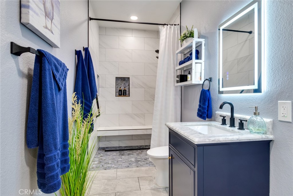 20885 Bakal Drive Riverside, CA 92508 - Photo 16 of 47 a bathroom with a sink and a mirror