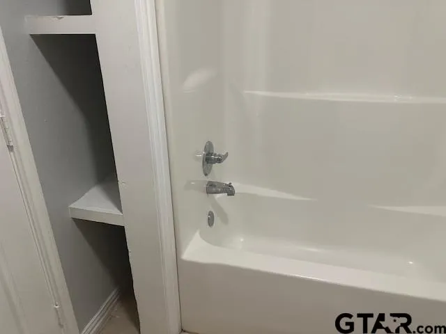 a bathroom with a bathtub
