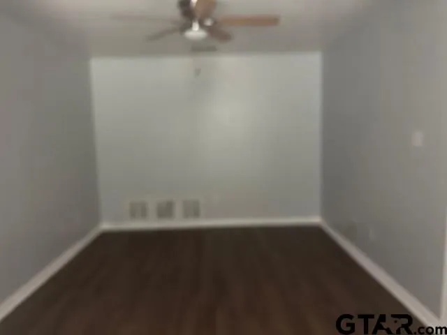 a view of a small space with wooden floor