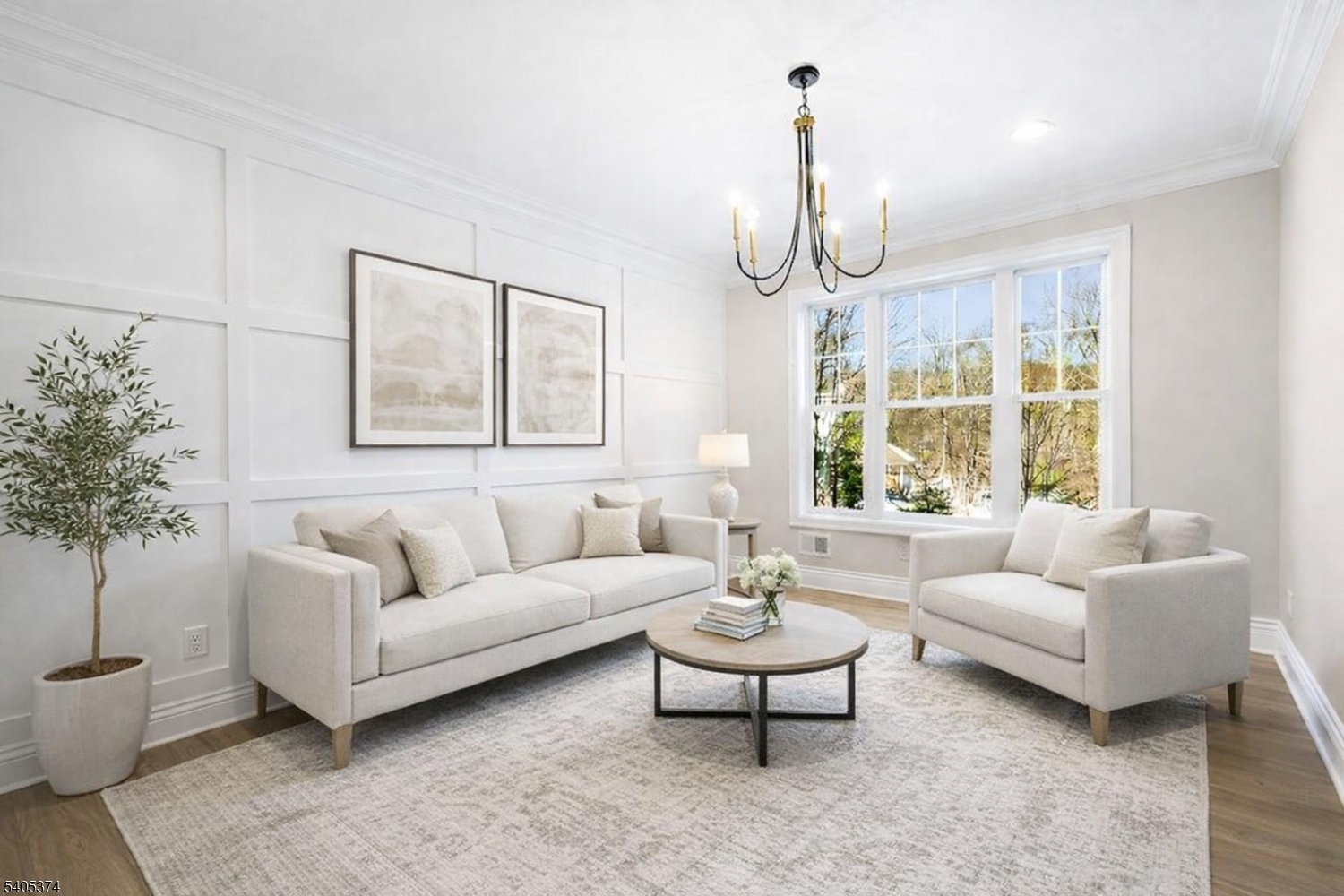 502 Tiffany Way Watchung, NJ 07069 - Photo 11 of 41 a living room with furniture chandelier and a large window