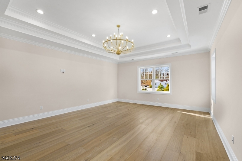 502 Tiffany Way Watchung, NJ 07069 - Photo 22 of 41 wooden floor in an empty room with a window